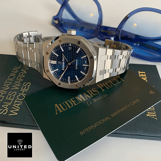 Audemars Piguet Royal Oak Blue Dial Replica side view next to warranty card