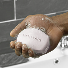 Hand holding a soap bar