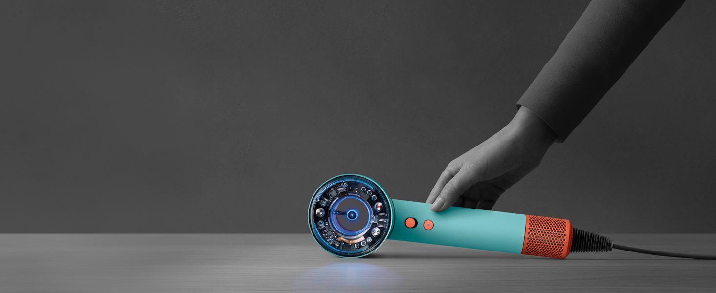 The hair dryer being put down