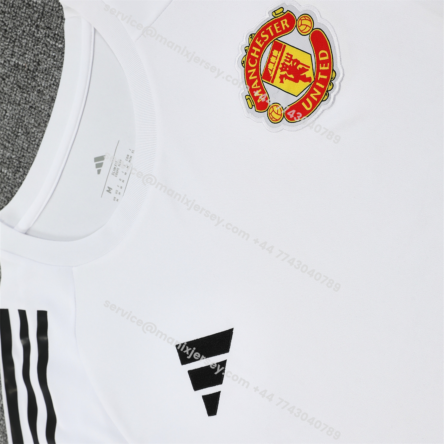 ManixJersey.com | Manchester United 25-26 Short-Sleeve Training Set - Red Black Blocks White Top & Black Shorts -Customize Name, Number and Patch | Worldwide Shipping