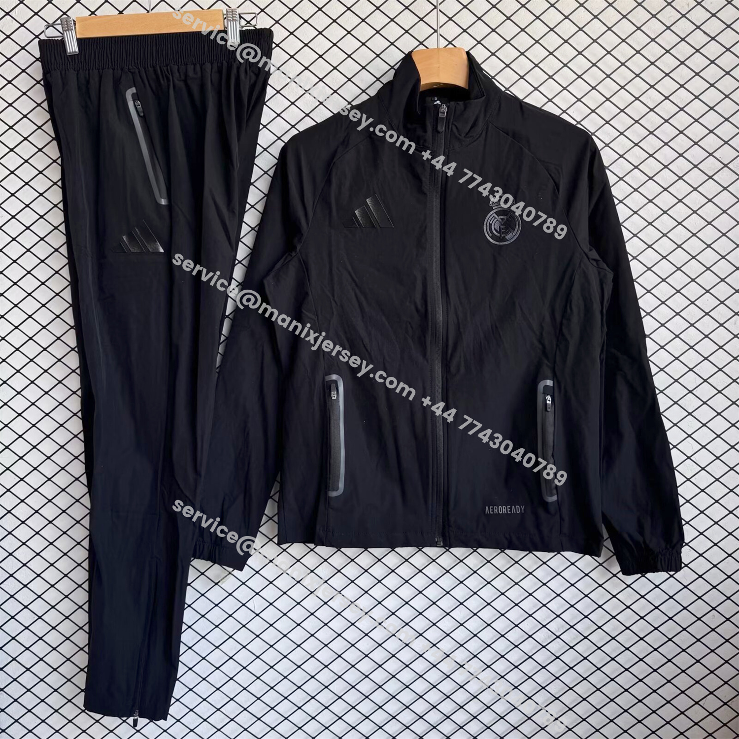ManixJersey.com | Real Madrid 25-26 Black Logo Windbreaker Training Set - Black Top and Pants -Customize Name, Number and Patch | Worldwide Shipping