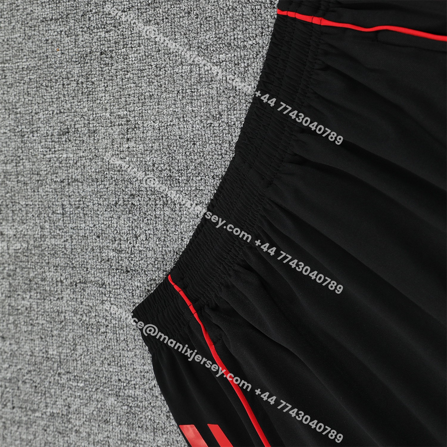 ManixJersey.com | Manchester United 25-26 Short-Sleeve Training Set - Red Black Blocks White Top & Black Shorts -Customize Name, Number and Patch | Worldwide Shipping