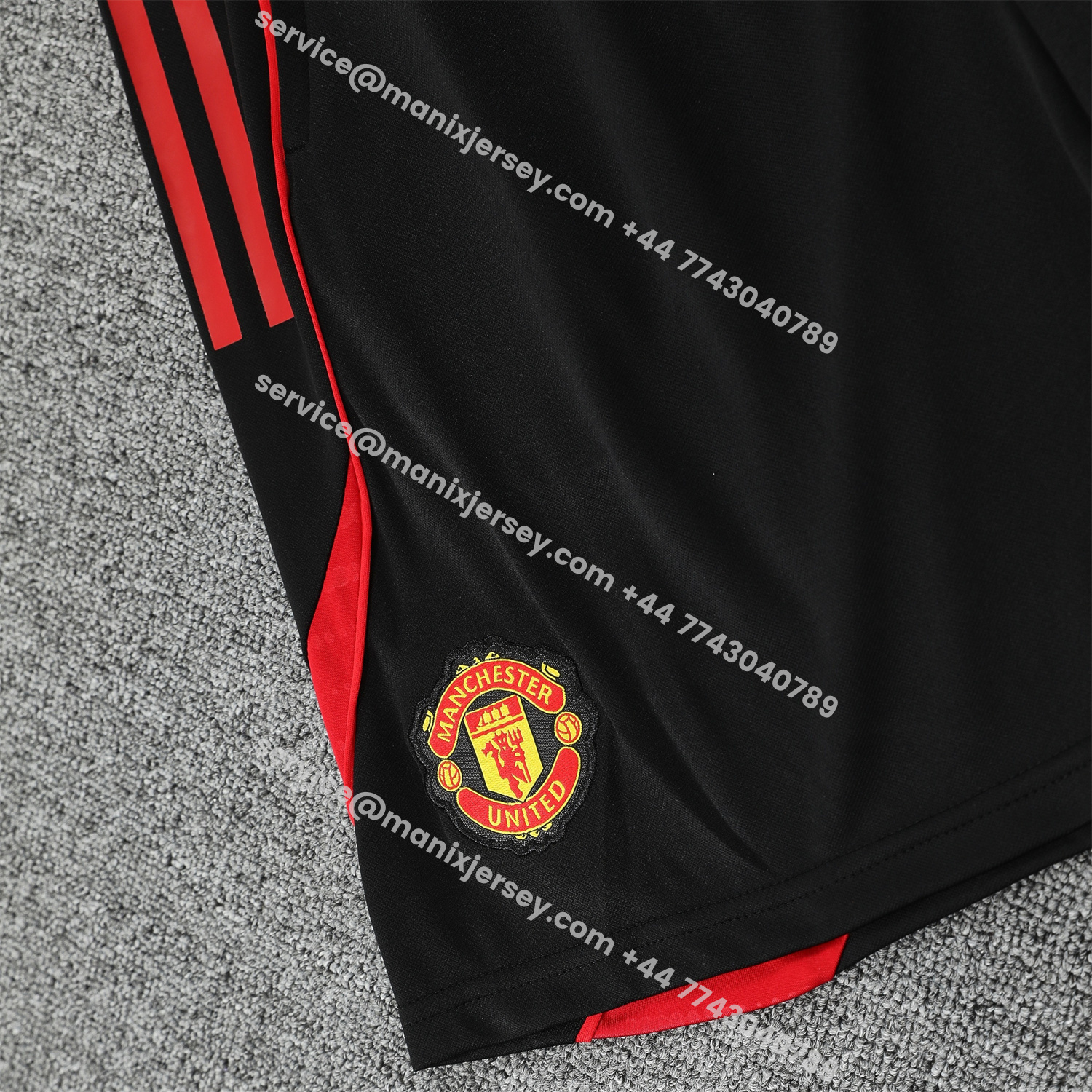 ManixJersey.com | Manchester United 25-26 Short-Sleeve Training Set - Red Black Blocks White Top & Black Shorts -Customize Name, Number and Patch | Worldwide Shipping
