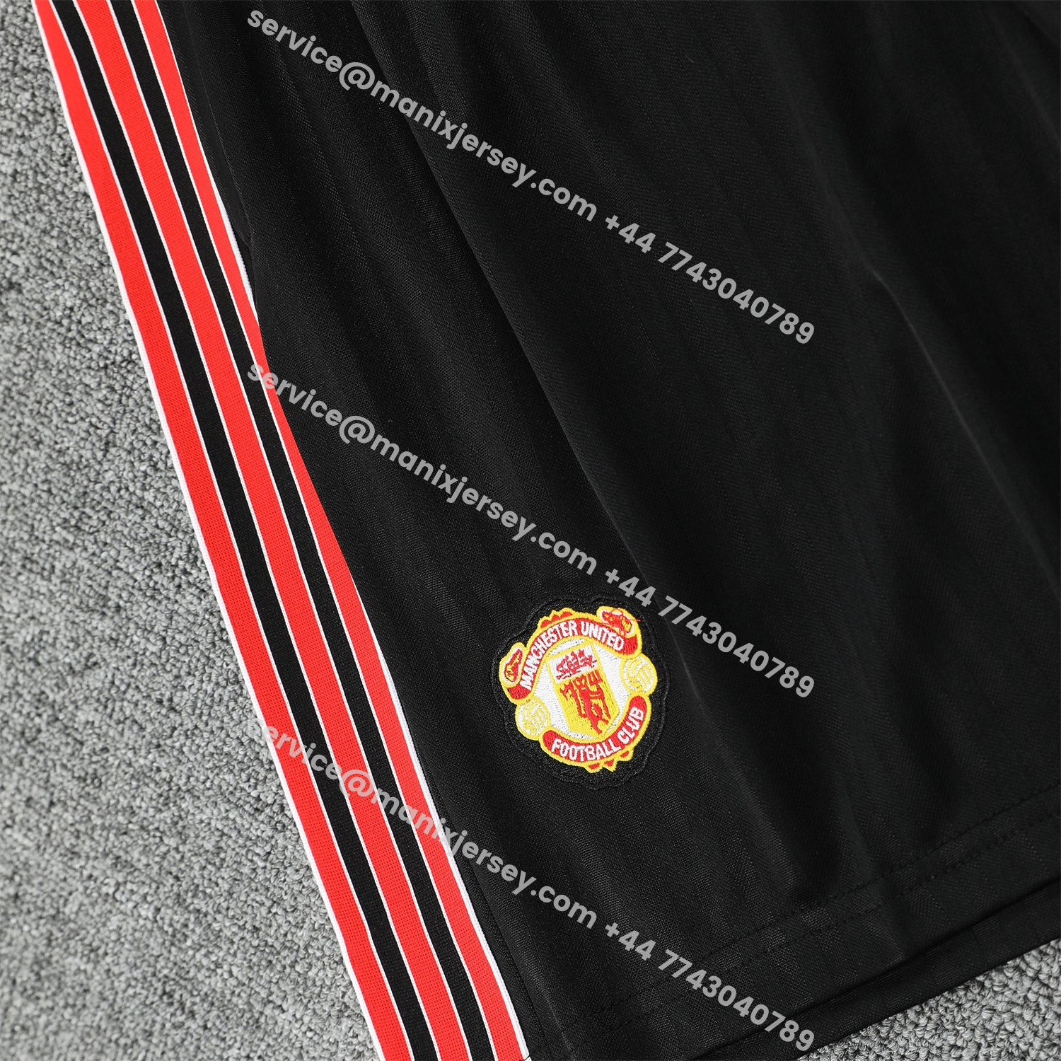 ManixJersey.com | Manchester United 25-26 Short-Sleeve Training Set - Red Lines Black Top & Black Shorts -Customize Name, Number and Patch | Worldwide Shipping