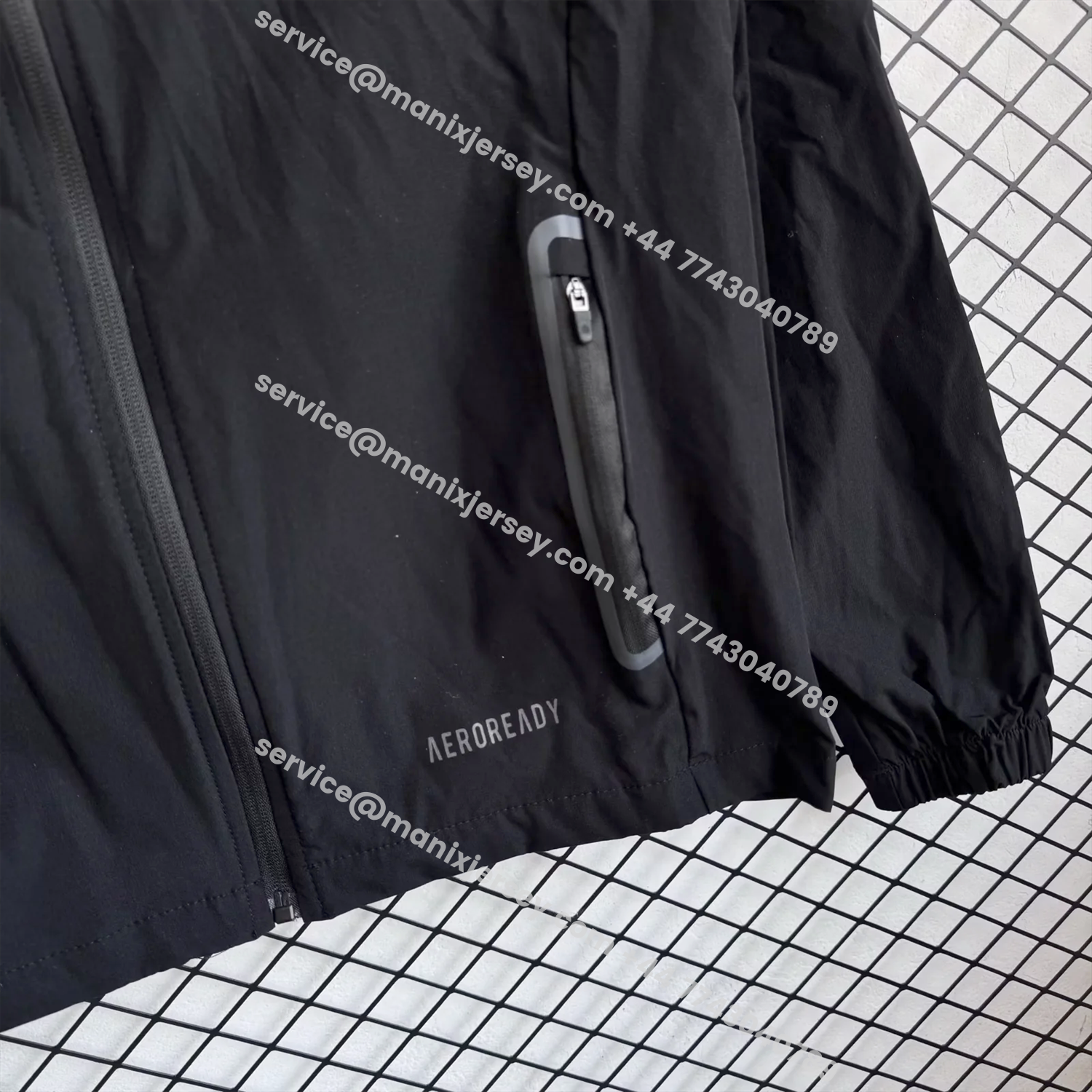 ManixJersey.com | Real Madrid 25-26 Black Logo Windbreaker Training Set - Black Top and Pants -Customize Name, Number and Patch | Worldwide Shipping