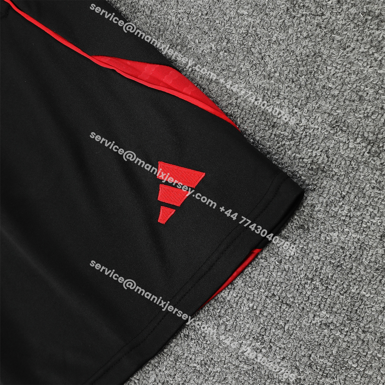 ManixJersey.com | Manchester United 25-26 Short-Sleeve Training Set - Red Black Blocks White Top & Black Shorts -Customize Name, Number and Patch | Worldwide Shipping