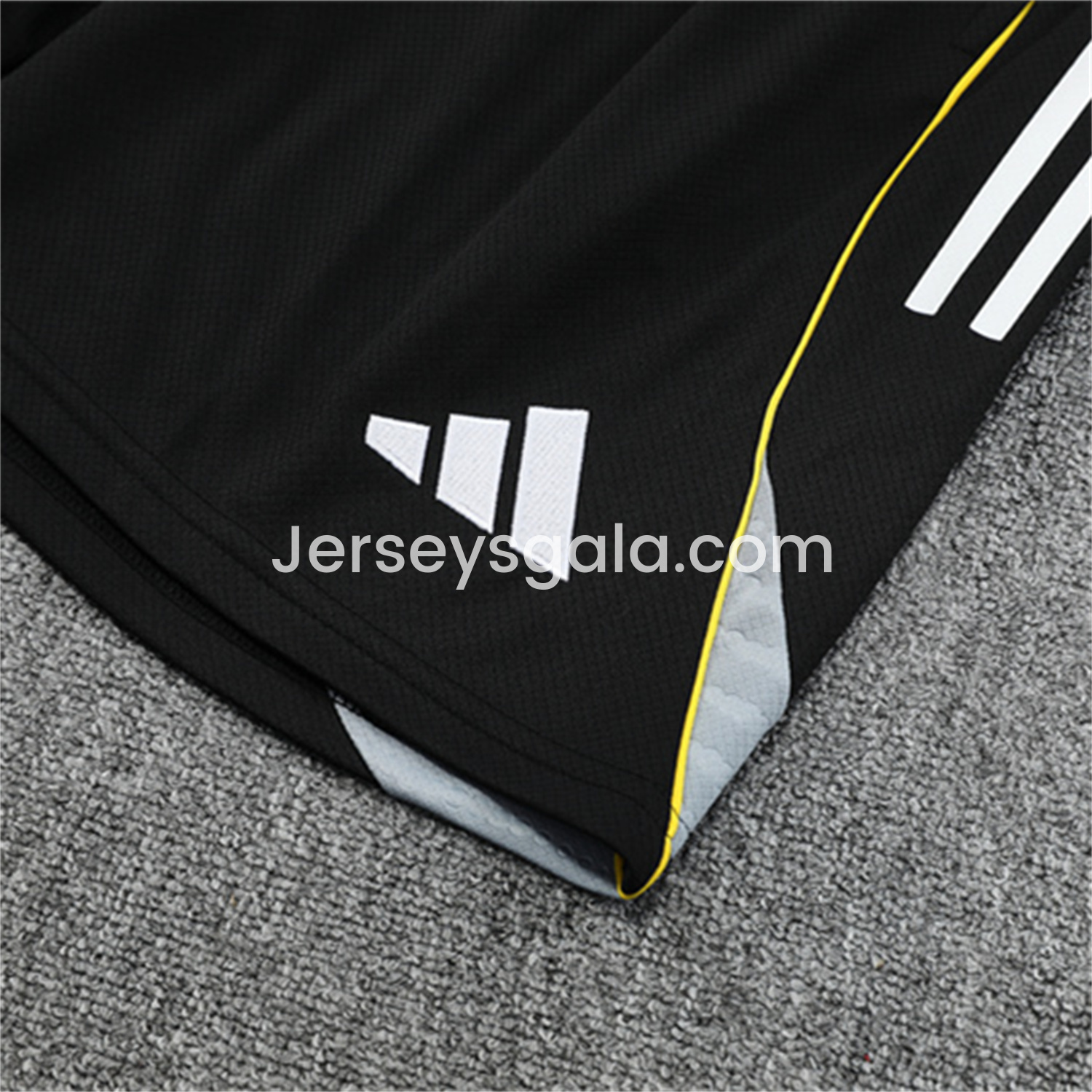 JerseysGala.com | Real Madrid 25-26 Kids Short-Sleeve Training Set - Yellow Line Black Top and Black Shorts -Customize Name, Number and Patch | Worldwide Shipping