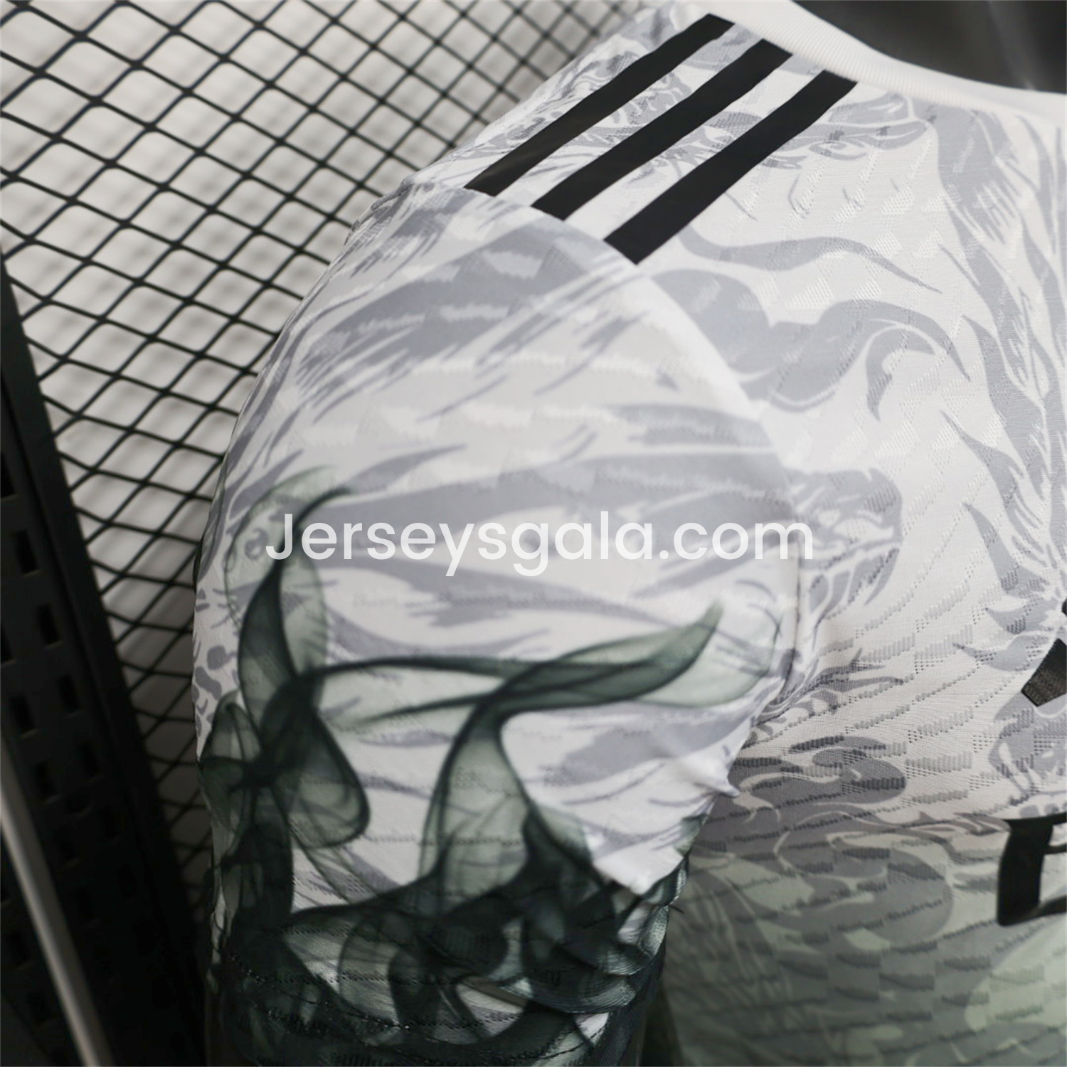 JerseysGala.com | Real Madrid 25-26 Black Green Dragon Soars White Jersey - Player Version -Customize Name, Number and Patch | Worldwide Shipping