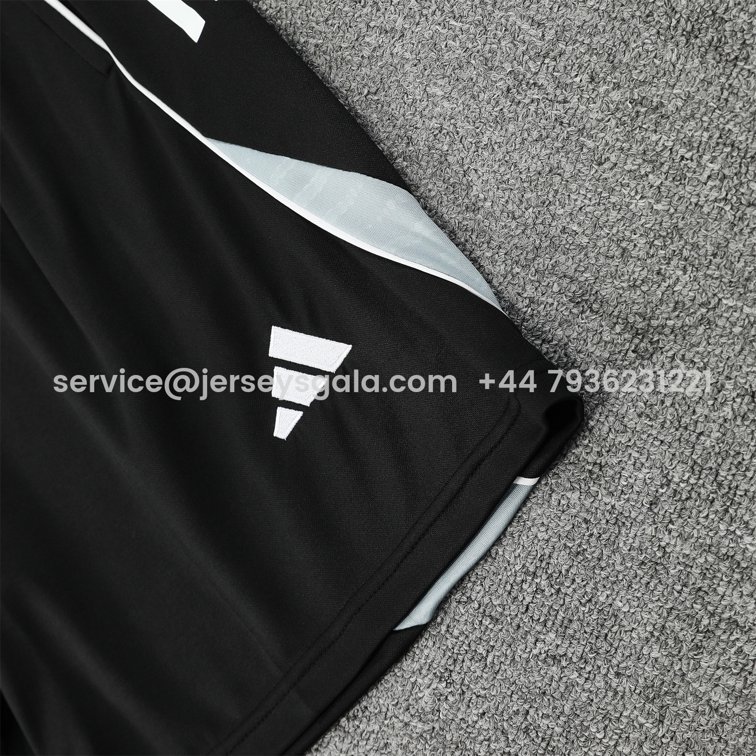 JerseysGala.com | Real Madrid 25-26 Short-Sleeve Training Set - Blue Purple Curve Pattern Top & Black Shorts -Customize Name, Number and Patch | Worldwide Shipping