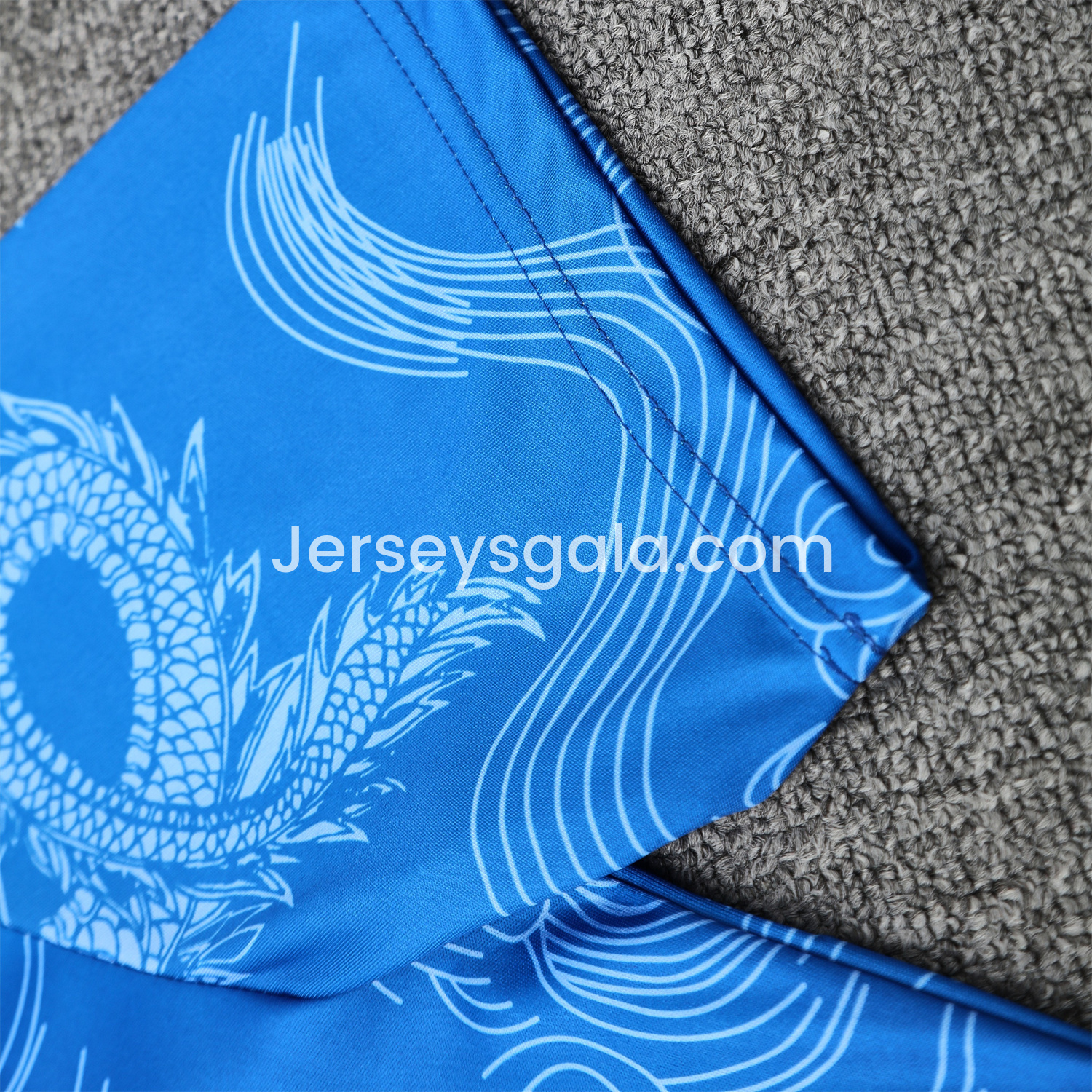 JerseysGala.com | Real Madrid 25-26 Short-Sleeve Training Set - Blue Black Dragon Top & Black-White Shorts -Customize Name, Number and Patch | Worldwide Shipping