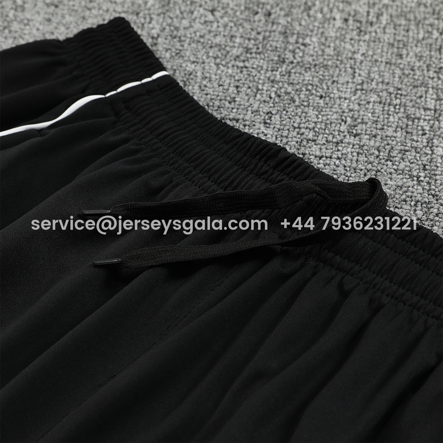 JerseysGala.com | Real Madrid 25-26 Short-Sleeve Training Set - Grey Arrow Pattern Top & Black Shorts -Customize Name, Number and Patch | Worldwide Shipping