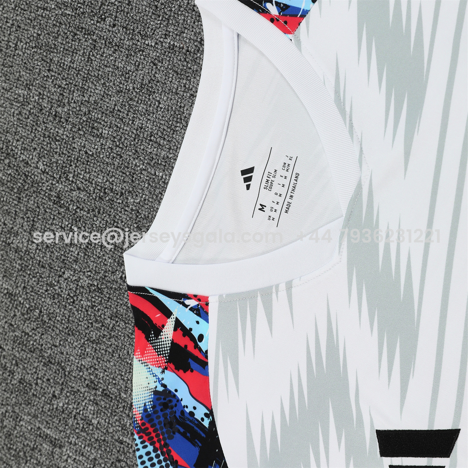 JerseysGala.com | Real Madrid 25-26 Short-Sleeve Training Set - Grey Arrow Pattern Top & Black Shorts -Customize Name, Number and Patch | Worldwide Shipping