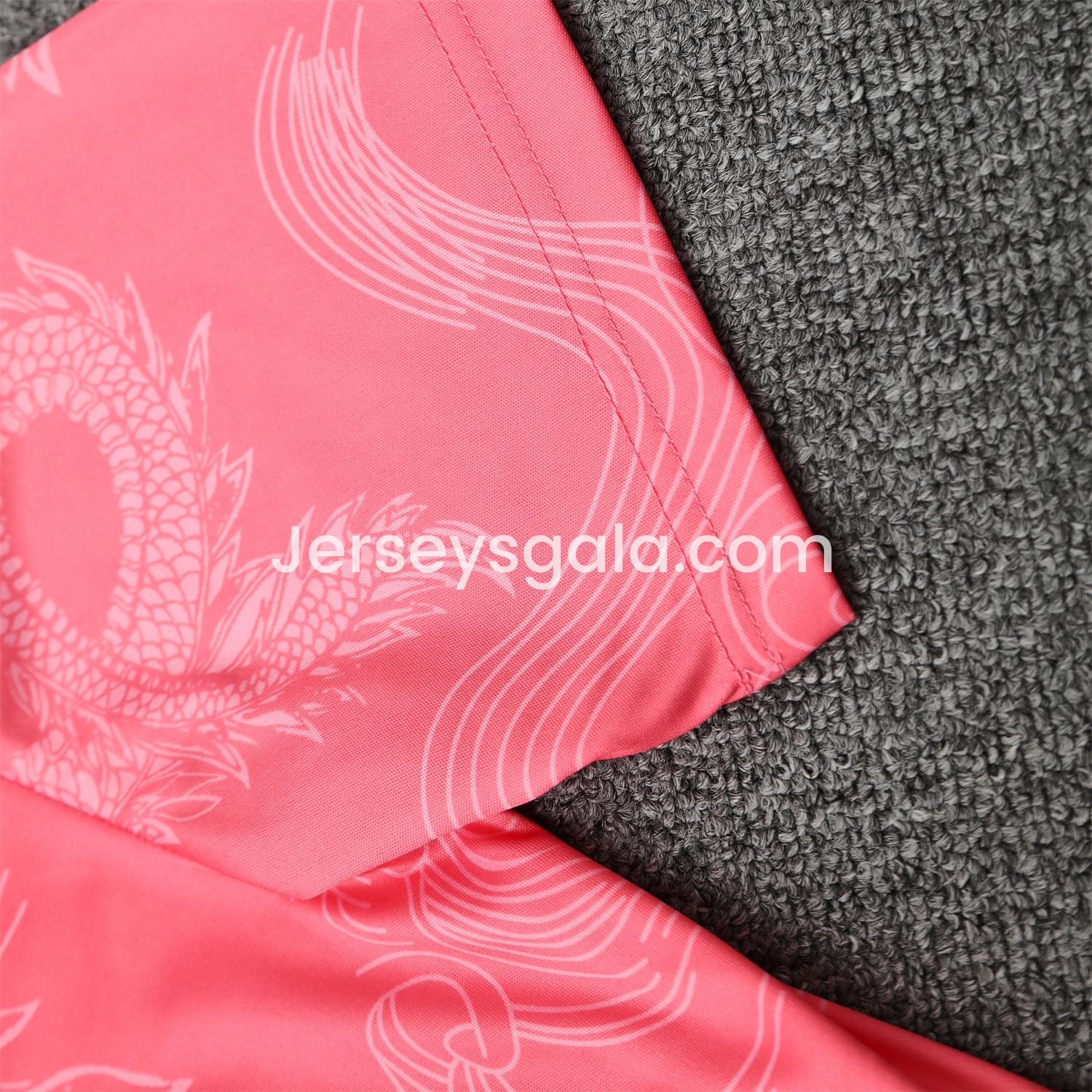 JerseysGala.com | Real Madrid 25-26 Short-Sleeve Training Set - Pink-Black Dragon Top & Black-White Shorts -Customize Name, Number and Patch | Worldwide Shipping