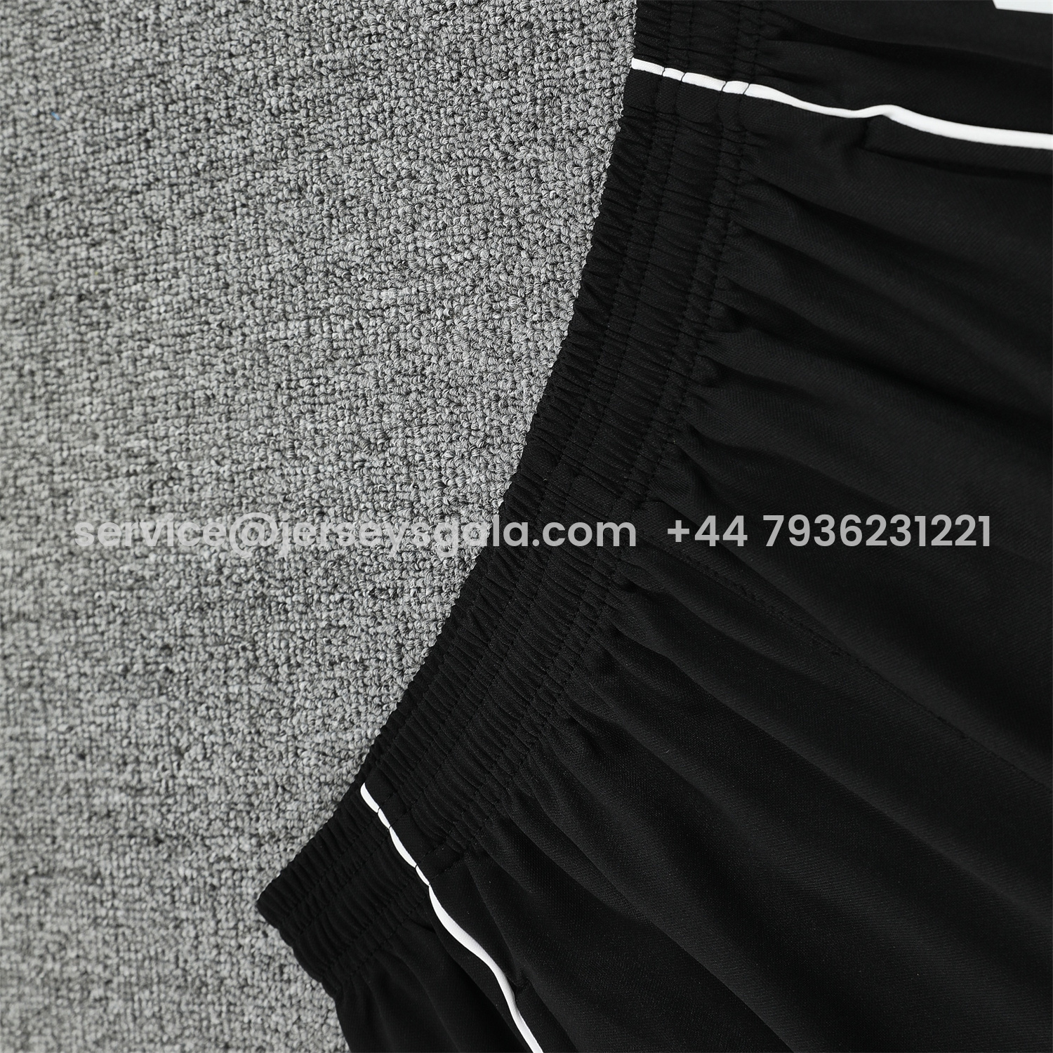 JerseysGala.com | Real Madrid 25-26 Short-Sleeve Training Set - Grey Arrow Pattern Top & Black Shorts -Customize Name, Number and Patch | Worldwide Shipping