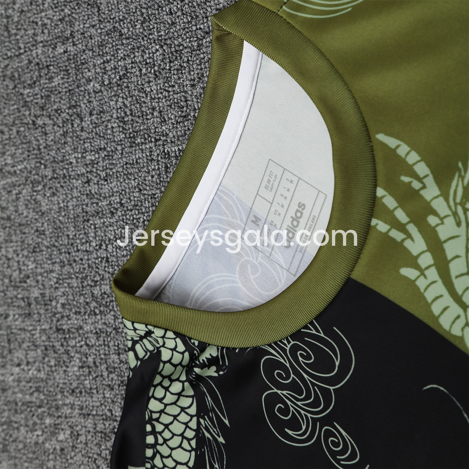 JerseysGala.com | Real Madrid 25-26 Short-Sleeve Training Set - Green-Black Dragon Top & Black-White Shorts -Customize Name, Number and Patch | Worldwide Shipping