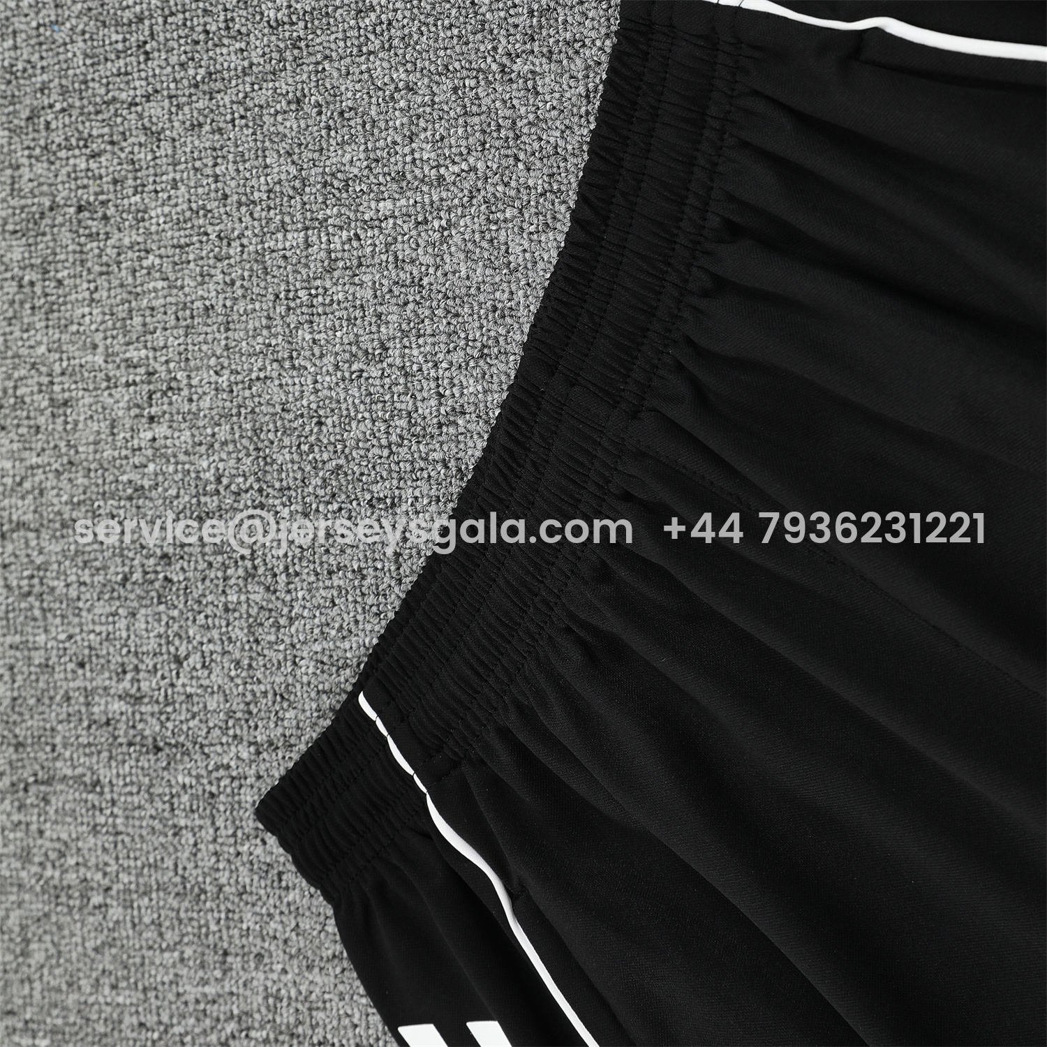 JerseysGala.com | Real Madrid 25-26 Short-Sleeve Training Set - Pink Arrow Pattern Top & Black Shorts -Customize Name, Number and Patch | Worldwide Shipping