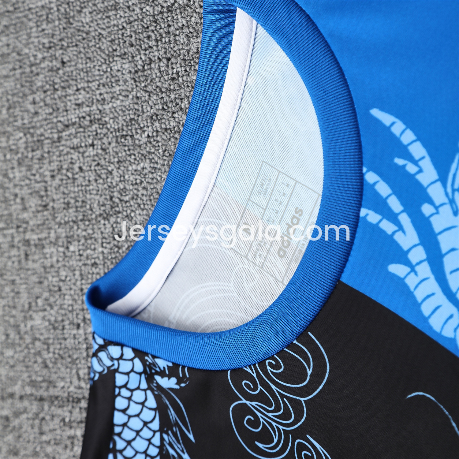 JerseysGala.com | Real Madrid 25-26 Short-Sleeve Training Set - Blue Black Dragon Top & Black-White Shorts -Customize Name, Number and Patch | Worldwide Shipping