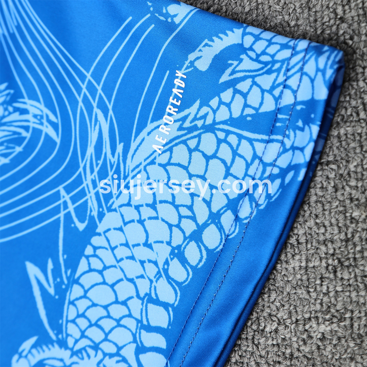 SIUjerseys-Real Madrid 25-26 Short-Sleeve Training Set - Blue Black Dragon Top & Black-White Shorts