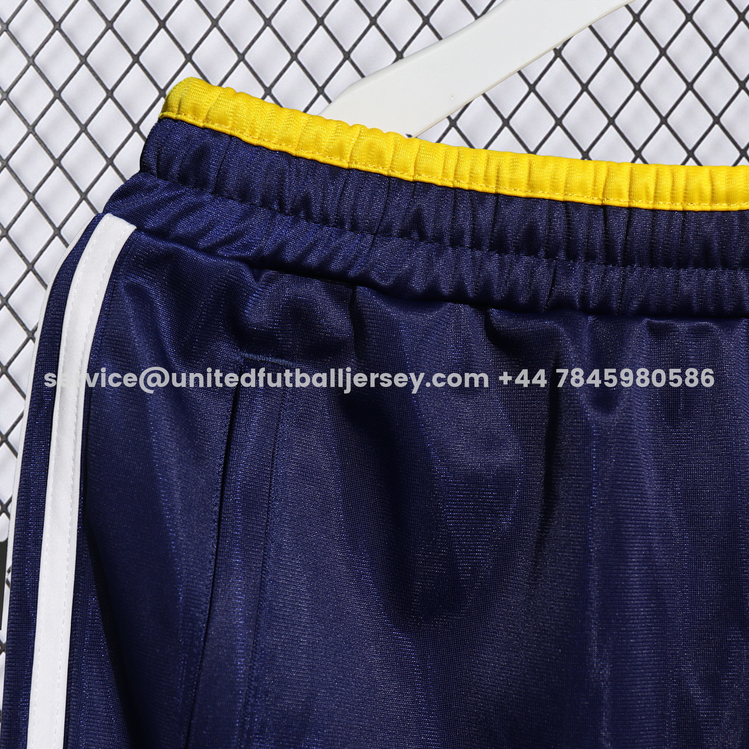 unitedfutballjersey-Real Madrid 25-26 Pure Color Yellow Lines Training Set - Dark Blue Top and Dark Blue Pants