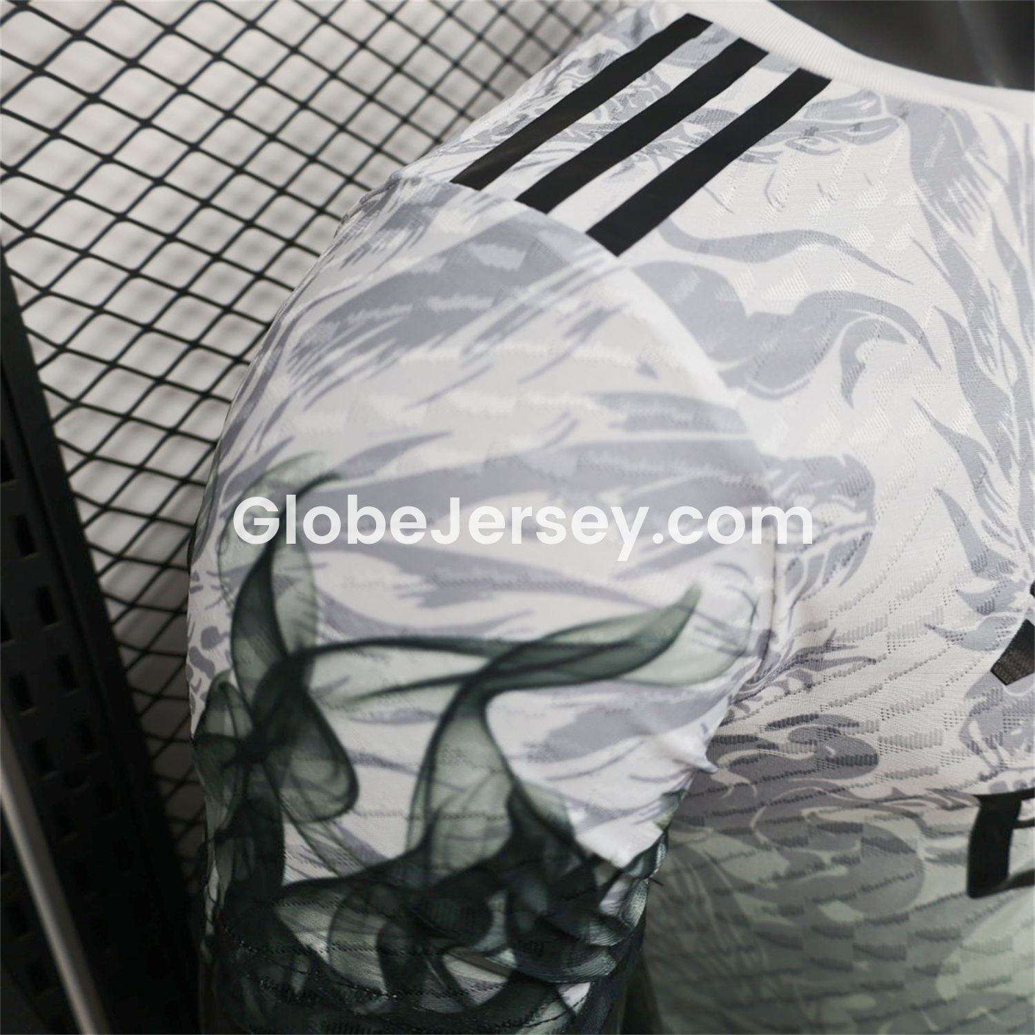 GlobeJersey-Real Madrid 25-26 Black Green Dragon Soars White Jersey - Player Version