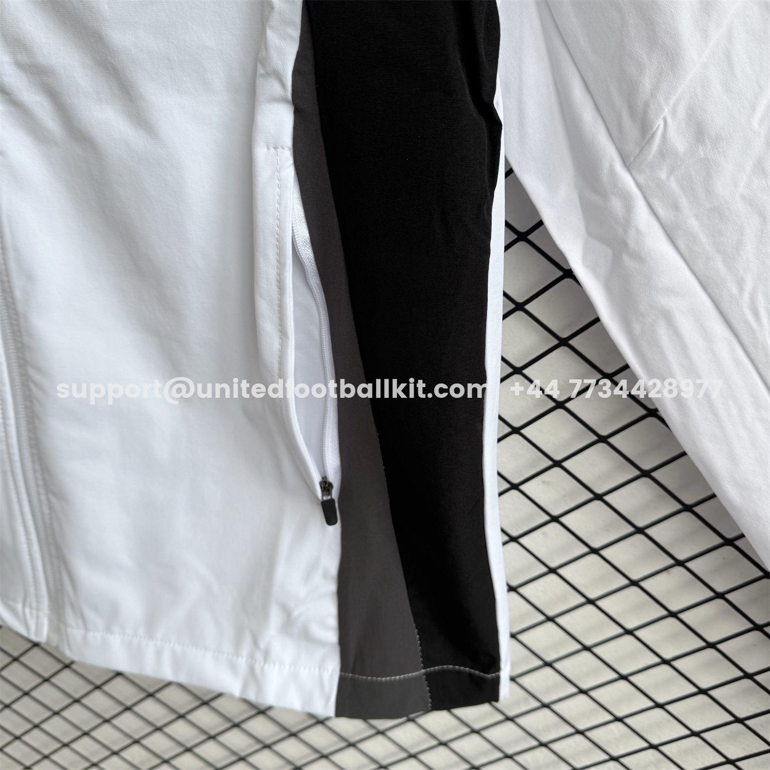 Unitedfootballkit.com | Real Madrid 25-26 Windbreaker Training Set - White With Black Top and Black Pants -Customize Name, Number and Patch | Worldwide Shipping