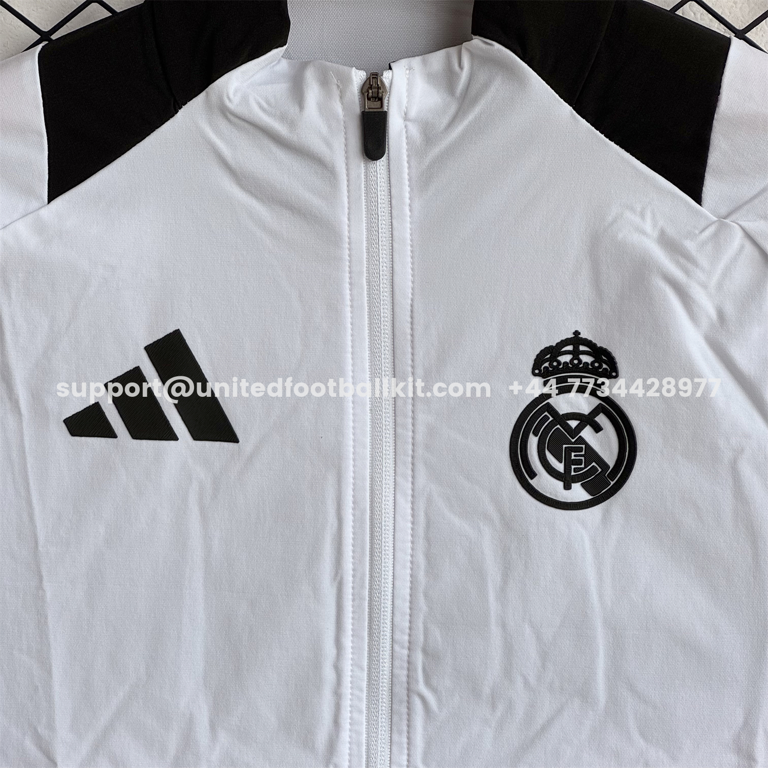 Unitedfootballkit.com | Real Madrid 25-26 Windbreaker Training Set - White With Black Top and Black Pants -Customize Name, Number and Patch | Worldwide Shipping
