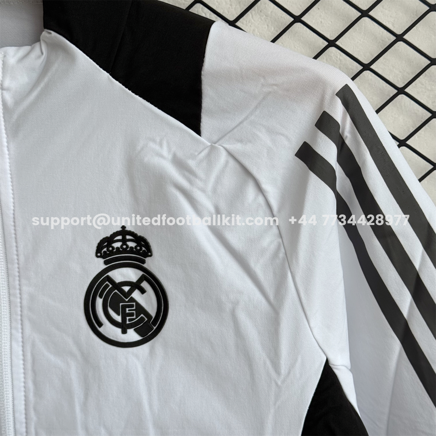 Unitedfootballkit.com | Real Madrid 25-26 Windbreaker Training Set - White With Black Top and Black Pants -Customize Name, Number and Patch | Worldwide Shipping