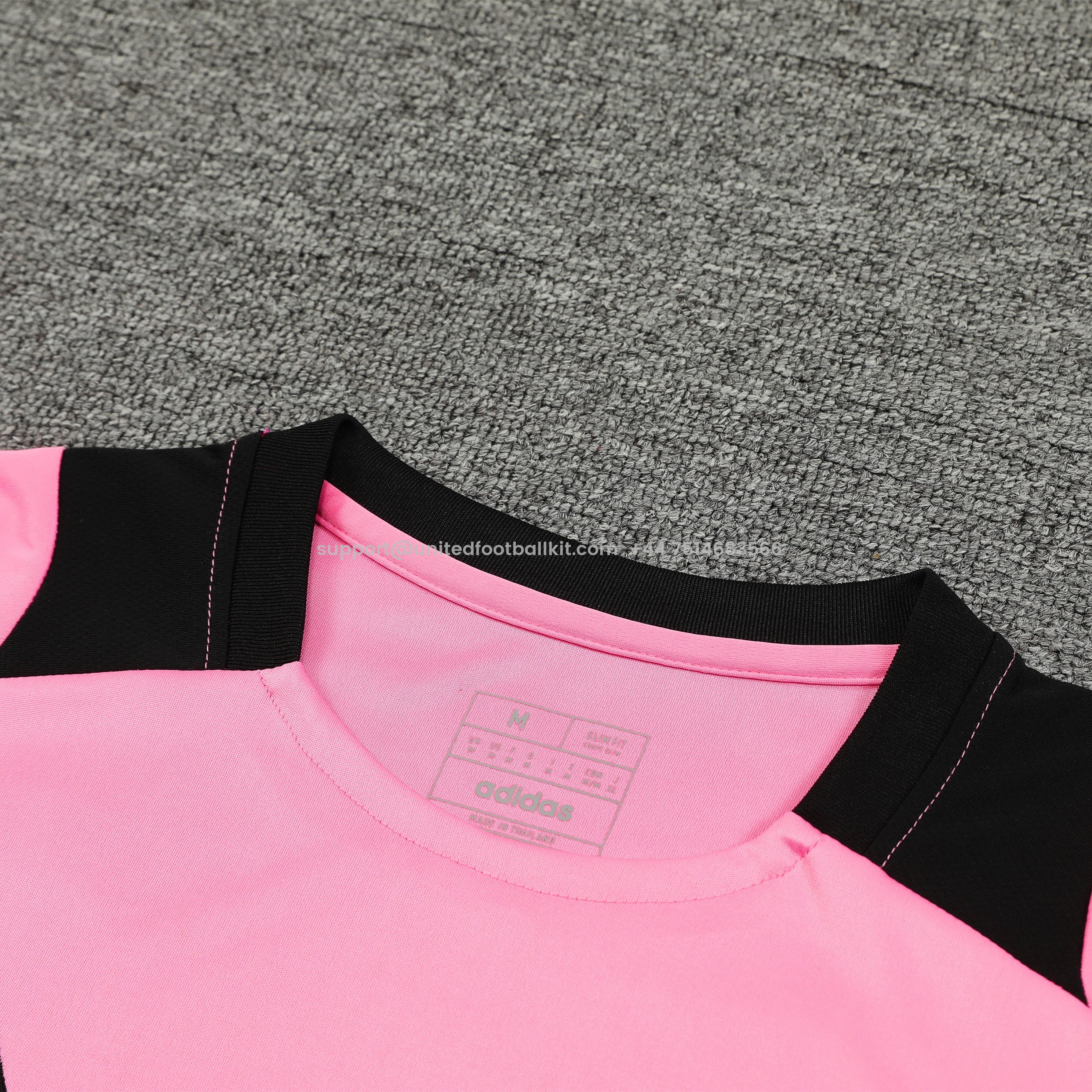 Unitedfootballkit.com | Manchester United 24-25 Short-Sleeve Training Set - Pink Top and Black Shorts -Customize Name, Number and Patch | Worldwide Shipping