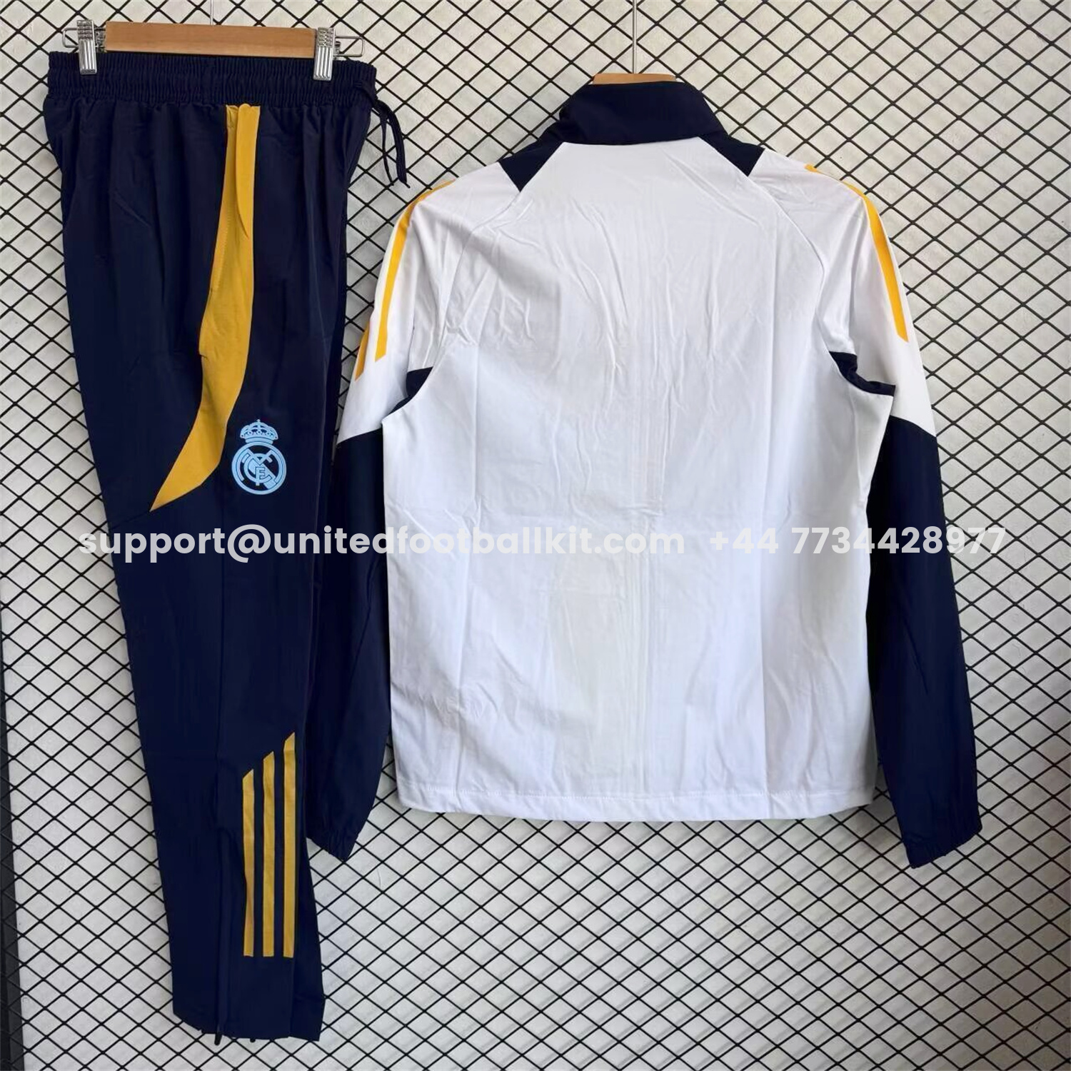 Unitedfootballkit.com | Real Madrid 25-26 Windbreaker Training Set - White Top and Black Pants -Customize Name, Number and Patch | Worldwide Shipping