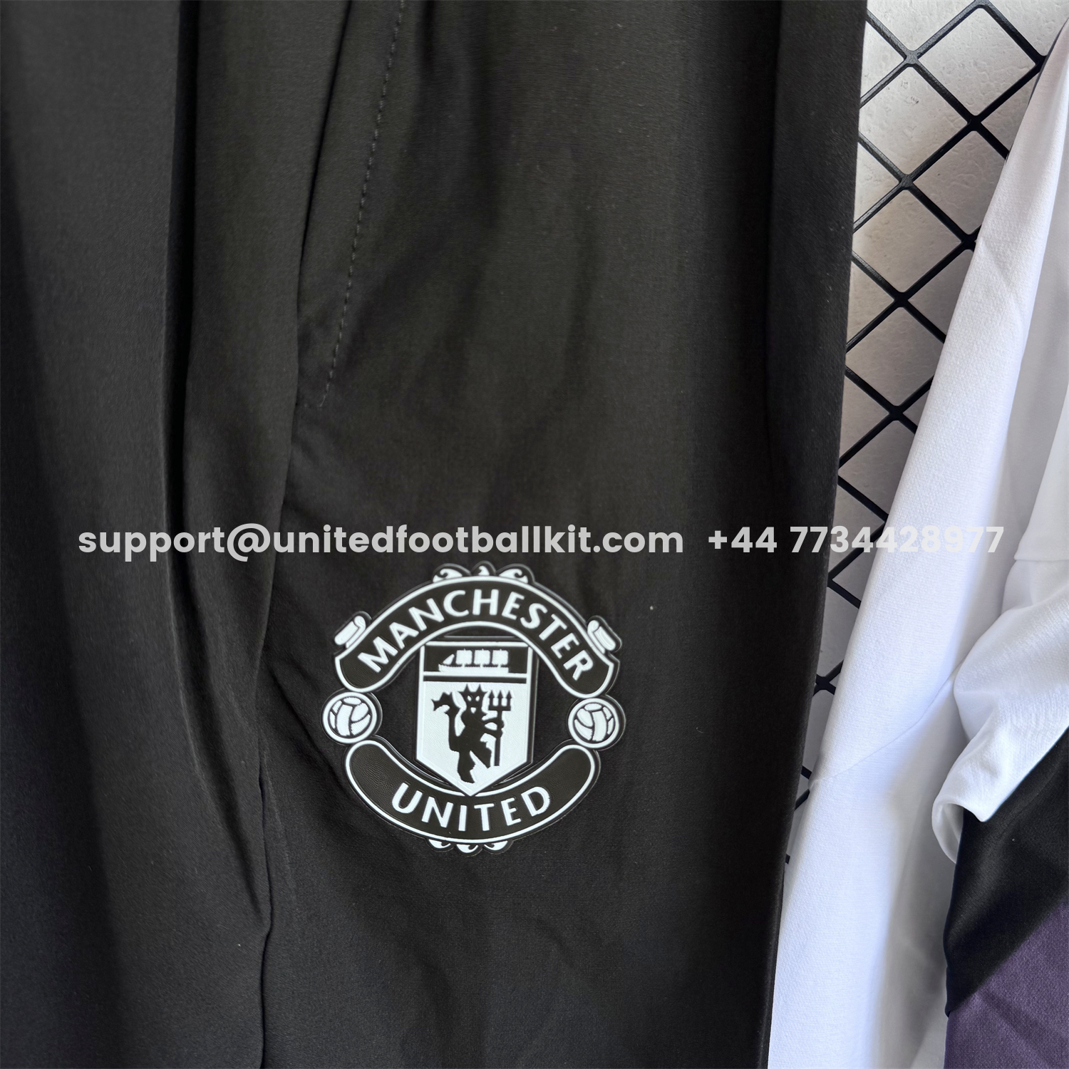 Unitedfootballkit.com | Manchester United 25-26 Windbreaker Training Set - White Top and Black Pants -Customize Name, Number and Patch | Worldwide Shipping